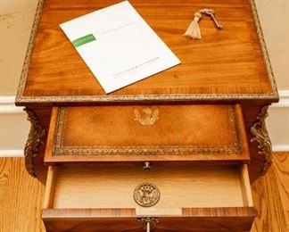 Same as Lot #21 — Theodore Alexander Althorp Living History French Influence Style Louis XV Accent Table — 
A mahogany and ormolu mounted lamp table, the rectangular top with a moulded brass edge above a brushing slide and lockable frieze drawer, on cabriole legs with Rococo mounts terminating in sabots. The original Louis XV, circa 1760. — 
Details:
* Collection: Althorp Living History
* Style: Louis XV
* Material: Rosewood Veneer
* Dimensions: 20.5"W x 14.5"D x 27"H
