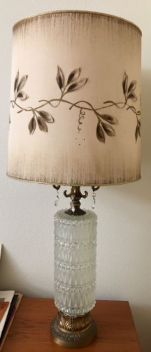 Fab Hollywood Regency Lamp. Crystal, gold toned metal, leafy cut-outs on shade that let the light through.  Look at progressive photos to get full effect. Excellent condition!