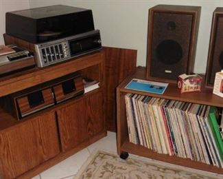 Rolling cart, TV stand/record holder. Stereo with turntable and speaker. 