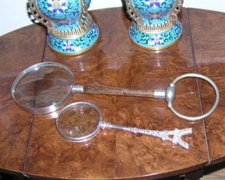 Item 60:
Magnifying Glasses... (there are many more than what is shown here)
A) Vintage Magnifying Glass - Overall Length 14.5" - Glass 4.5" in diameter - Huge! Asking Price: $125.00
B) Vintage Eiffel Tower Magnifying Glass - Overall Length 9" - Glass 3" in diameter - Asking Price: $45.00
