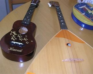 Item 67:
Musical Instruments...
A) Ukelele from Hawaii - Leolani - OMI Int'l Inc. - Asking Price: $30.00
B) Balalaika Russian Instrument - Just like in the Beatles' song! - Asking Price: $149.00
