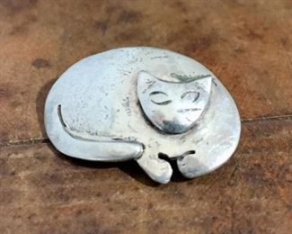 Vintage sterling silver cat brooch, size 1 1/8" w x 3/4" h.  Signed  WinD '90, stamped S.S.  Rolling c-clasp works perfectly.  $70