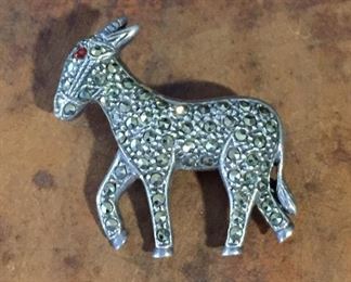 Vintage marcasite, garnet and sterling silver donkey brooch, size 1 1/4" w x 1 1/8" h. Signed T.H.H. with copyright symbol. Rolling c-clasp works perfectly. $48