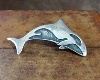 Vintage sterling silver Orca whale brooch, size 2" wide by 1 1/4" high. Signed SUE B, stamped 925. $60