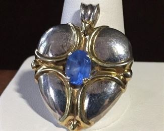 Gorham sterling heart cross pendant accented with blue faceted gemstone. John 3:16 bible verse is engraved on back  (For God so loved the world that He gave His only begotten Son). Size 1" wide by 1 5/16" high (including bale).  Signed GORHAM, stamped STERLING. $80