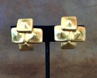 Robert Lee Morris gold-tone metal clip earrings. Size 1 1/8" wide by 1 1/8" high. Signed ROBERT LEE MORRIS on back of clip and also signed ROBERT LEE MORRIS on a circular cartouche on back of each earring. $90