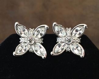 Swarovski vintage clip earrings with clear crystals. Size 3/4" x 3/4". Signed SWAROVSKI on clip backs and stamped with circular swan stamp and circle c mark. $80