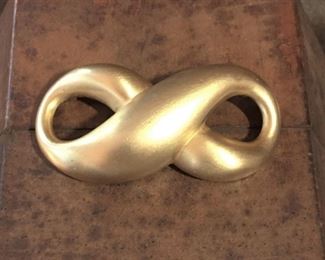 Givenchy large gold-tone metal infinity brooch. Size 2 5/8" wide by 1 1/4" high. Signed GIVENCHY on oval-shaped cartouche on back side of brooch. $68