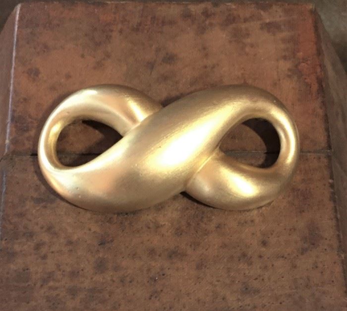 Givenchy large gold-tone metal infinity brooch. Size 2 5/8" wide by 1 1/4" high. Signed GIVENCHY on oval-shaped cartouche on back side of brooch. $68