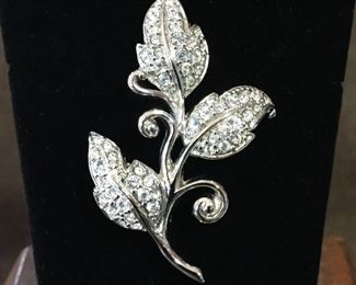 Swarovski crystal studded leaf brooch. Size 1 3/8" wide by 2" high. Stamped with Swarovski circular swan logo. $60