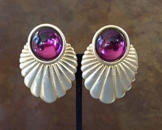 Jay Feinberg (Strongwater) art deco-style gold-tone metal and purple glass clip earrings. Size 1 1/2" wide by 2" high. Signed JAY FEINBERG on rectangular cartouche on back of each earring. $60