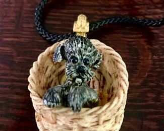 Razza  vintage resin puppy in basket pendant on braided cord necklace.   Pendant is 2.5" tall by 1.5" wide.  $40