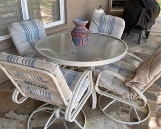 Patio Set with table and 4 cushioned swivel rocker chairs