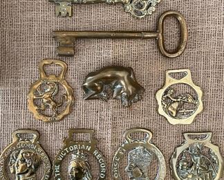 English brass horse bridle medallions, bronze dog and large ornate brass keys