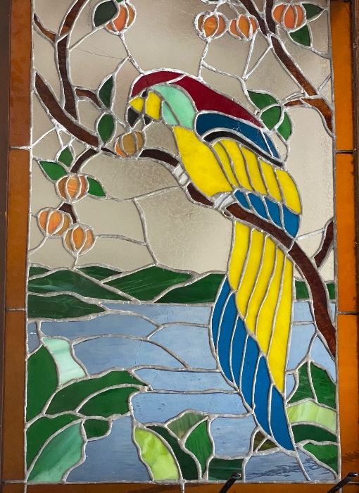 Stained glass window of a parrot