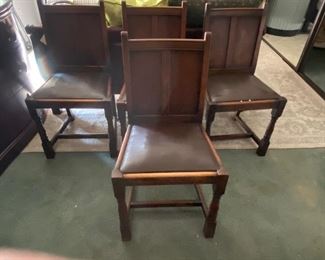 Set if foyr leather upholstered European dining chairs