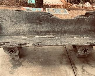 Natural edge rustic trunk bench carved from a single log