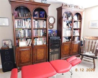 Beautiful bookcases. Portable massage table.