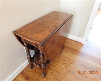 Burl walnut gate leg table.