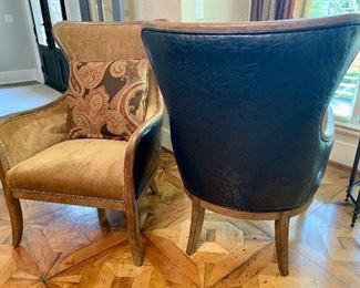 pair of matching chairs with leather backs