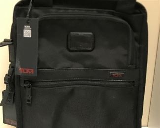 New with tags TUMI luggage. 