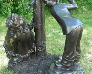 Adorable bronze sculpture of children at well