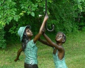 Bronze sculpture/fountain of two children with umbrella