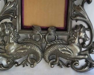 Frame W/ Cherubs/Putti & Sea Dragons. Marked on Back. Over all frame size 14" T x 10 1/4" W.  Interior dimensions 4 1/4" x 6"