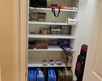 closet with office supplies and 4 box fans