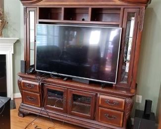 large entertainment center and flat screen TV