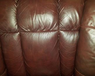 1 brown leather reclining sofa and 1 brown leather reclining chair, both by LazBoy