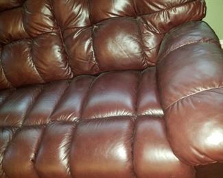 1 brown leather reclining sofa and 1 brown leather reclining chair, both by LazBoy
