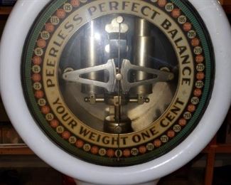 Antique "Peerless Perfect Balance Your Weight One Cent" scale.  Ceramic tile platform. Porcelain plaque of policeman missing. . : 69" high overall x 24" deep x 14" wide. Dial 15".  Circa 1930.  $1,000