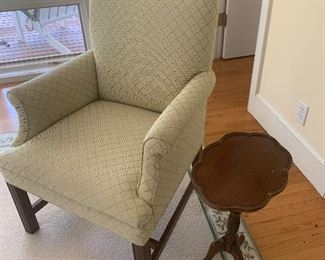 Upholstered Chair 
Small antique table 