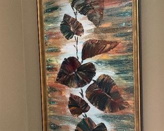 Framed oil painting of tropical leaves