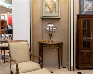 Matching chair and ottoman!  The Tiffany style lamp behind is so pretty.