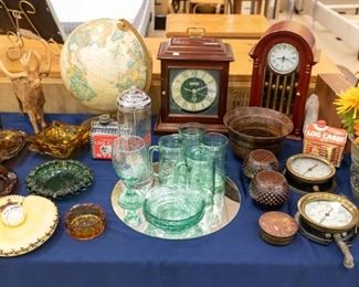 Some unique green coke glasses, clocks, and collectibles.