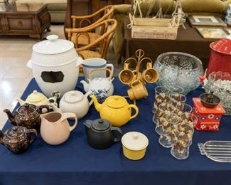 The White/black glass container in the back is a drink dispenser.  Note the vintage metal stand and coffee cups!  Teapot collection!