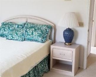 Bedroom set includes bed, two nightstands, tall chest of drawers, long dresser with mirror