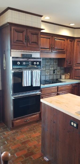 Solid wood kitchen cabinets by QuakerMaid; Roper double oven