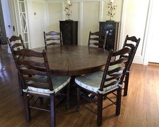 French Heritage pine round table. Internal mechanism converts seating from 6 to 10. From ABC Carpet NYC.