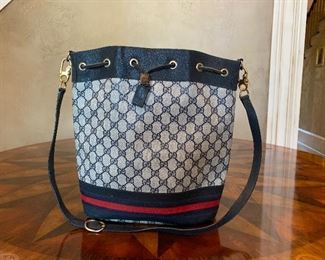 Gucci Supreme web GG monogram coated canvas bucket bag with shoulder strap