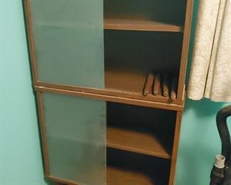 mid century peg leg book cases with sliding doors