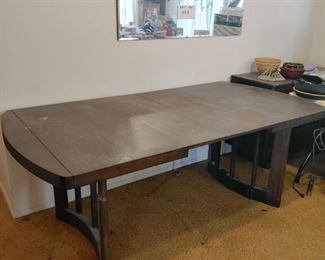 dark wood table with leaves. Matching chairs photographed separately. 