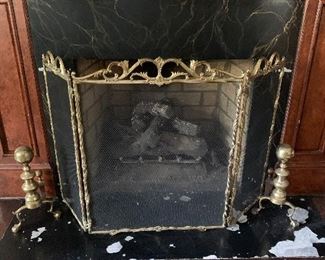 Brass fireplace andirons and fire screen