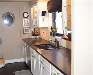 Cabinets with counters, sink and faucet @ $2,640