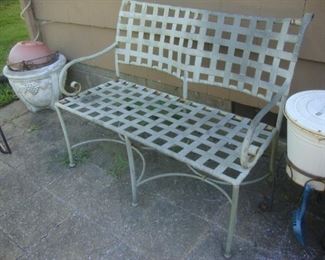 Iron settee with woven seat