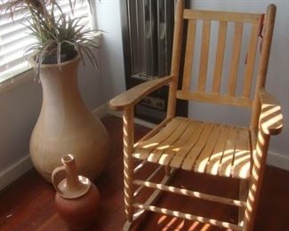 Oak rocking chair with large pottery
