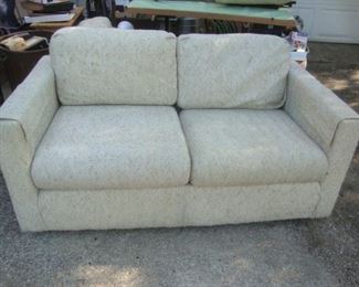 Loveseat with cream colored tweed upholstery