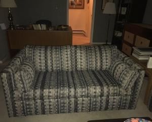 Upholstered love seat, matches sofa